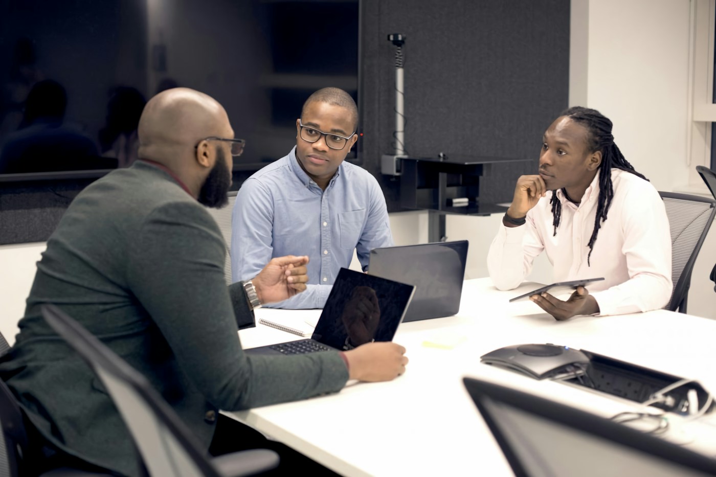 Colleagues reviewing work in a meeting